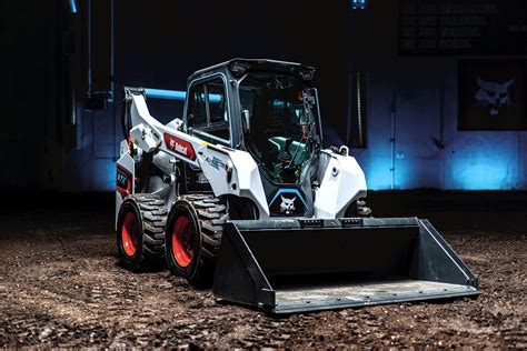 bobcat skid steer bouncing down the road|walk behind front end loader.